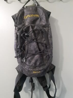 Dakine Black Shuttle Hydration Backpack with Yellow Logo